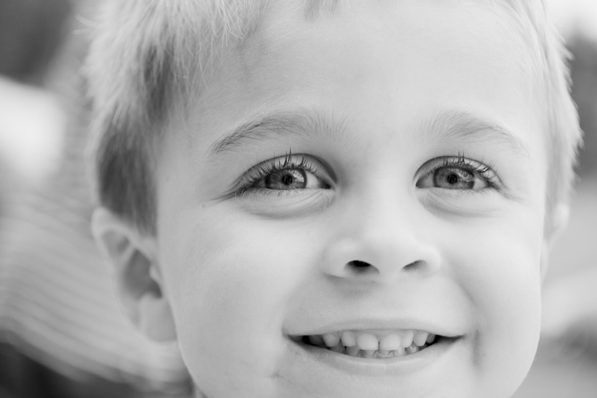 grayscale-photo-of-toddler-smiling-1118429